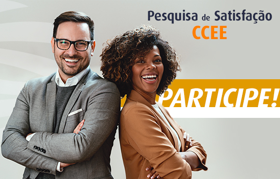 A imagem mostra dois executivos, um homem branco, de terno, e uma mulher negra, vestida com um tailleur. Ambos sorriem.